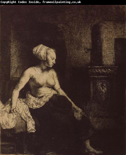 REMBRANDT Harmenszoon van Rijn Woman sitting Half-Dressed beside a Stove