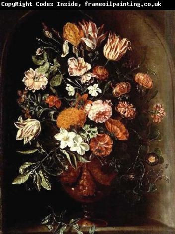 unknow artist A still life with tulips, roses, a red turban cup lily, auricula, jasmin, an iris, carnations and other flowers in a vase, all in a stone niche.